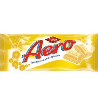 A Nestle Aero White Chocolate bar showing the bubbly white center.