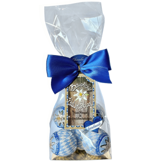 Gift bag with blue ribbon and Christmas-themed items on a white background