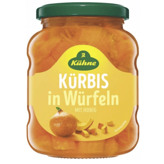 Jar of Küßeöne pumpkin cubes with honey on a white background