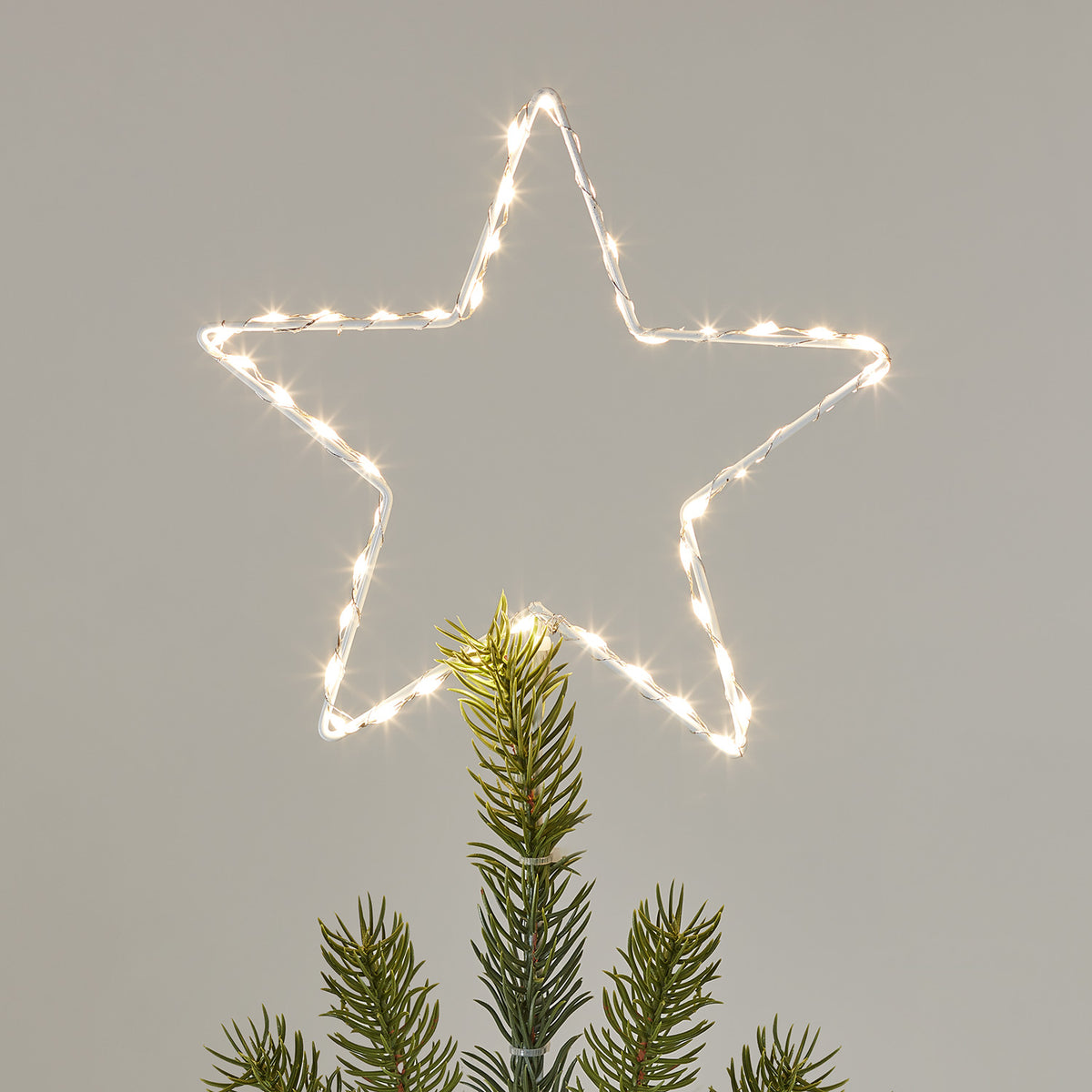 LED Weihnachtsbaumspitze in Sternform mit warmweißen Micro LEDs auf weißem Draht