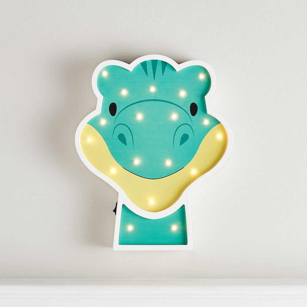 Kinderzimmer Wandlampe in Form eines grünen Diplodocus mit warmweißen LEDs an der Wand