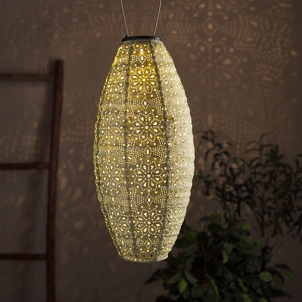 Ovaler, beleuchteter Tyvek Solar Lampion mit Muster, der Lichtmuster an Wand wirft